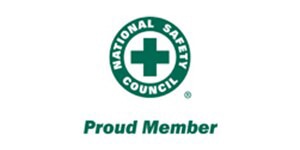 Siegel „Proud Member“ des National Safety Council mit grünem Logo in Form eines medizinischen Kreuzes auf weißem Hintergrund.